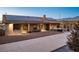 This exterior elevation of the home shows solar panels, a patio, and a backyard at 2051 Saginaw Ave, Pahrump, NV 89048