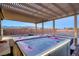 Relaxing hot tub under a pergola with a mountain view, perfect for outdoor enjoyment at 2051 Saginaw Ave, Pahrump, NV 89048