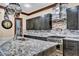 Elegant kitchen featuring stainless steel appliances, gray cabinets, and granite counters at 2051 Saginaw Ave, Pahrump, NV 89048