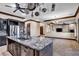 Beautiful kitchen featuring granite island, stainless steel appliances, and gray cabinets at 2051 Saginaw Ave, Pahrump, NV 89048