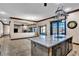 Granite island kitchen with view of living room and backyard access at 2051 Saginaw Ave, Pahrump, NV 89048