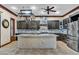 Spacious kitchen with dark wood cabinets, granite countertops, and stainless steel appliances at 2051 Saginaw Ave, Pahrump, NV 89048