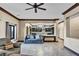 Spacious living room with stylish furnishings, seamless transition to kitchen, and abundant natural light at 2051 Saginaw Ave, Pahrump, NV 89048