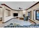 Bright living room featuring large windows, fireplace, tile flooring, and comfortable seating arrangement at 2051 Saginaw Ave, Pahrump, NV 89048