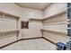 Large walk-in closet with built-in shelves providing ample storage for clothing and accessories at 2051 Saginaw Ave, Pahrump, NV 89048
