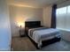 Bedroom with a Queen bed, table lamp, and neutral carpet that make it cozy at 2064 Mesquite Ln # 304, Laughlin, NV 89029