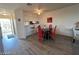 This dining area features a modern table set, red chairs, and hardwood floors at 2064 Mesquite Ln # 304, Laughlin, NV 89029