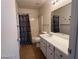 Bathroom with a single sink vanity and shower/tub, enhanced by ample lighting at 2064 Mesquite Ln # 304, Laughlin, NV 89029