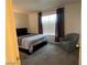 Bedroom with a Queen bed, chair, and neutral carpet that make it cozy at 2064 Mesquite Ln # 304, Laughlin, NV 89029