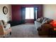 This living room features a cozy sofa, carpet floors, and modern decor at 2064 Mesquite Ln # 304, Laughlin, NV 89029