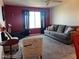 This living room features a cozy sofa, carpet floors, and modern decor at 2064 Mesquite Ln # 304, Laughlin, NV 89029
