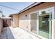 A fenced backyard featuring a sliding glass door entrance to the house at 208 N Bruce St # A, Las Vegas, NV 89101