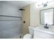 Modern bathroom featuring a shower with gray tiling and matte black fixtures at 208 N Bruce St # A, Las Vegas, NV 89101