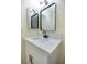 Updated bathroom featuring a new vanity, sink, lighting and matte black fixtures at 208 N Bruce St # A, Las Vegas, NV 89101