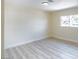 An empty bedroom with neutral walls and flooring and one window at 208 N Bruce St # A, Las Vegas, NV 89101