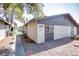 Exterior view of home featuring stone landscaping and shaded walk way at 208 N Bruce St # A, Las Vegas, NV 89101