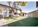 A lovely exterior view of a building surrounded by grass and a mature tree at 208 N Bruce St # A, Las Vegas, NV 89101