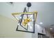 Modern light fixture in kitchen with black trim and gold light sockets at 208 N Bruce St # A, Las Vegas, NV 89101