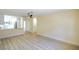Spacious living room with hardwood flooring, leading into a well lit open-concept kitchen at 208 N Bruce St # A, Las Vegas, NV 89101