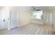 Bright open living room view of a kitchen with counter seating, hardwood floors, and white trim at 208 N Bruce St # A, Las Vegas, NV 89101