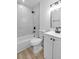 Bright bathroom featuring a modern tub and shower, with white fixtures and clean finishes at 2105 Berkley Ave, Las Vegas, NV 89101