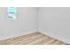 Neat bedroom featuring wood-look floors and a window for natural light at 2105 Berkley Ave, Las Vegas, NV 89101
