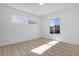 Well-lit bedroom with sleek wood-look floors and bright windows at 2105 Berkley Ave, Las Vegas, NV 89101