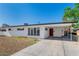 Charming single-story home with clean modern lines, a covered carport, and mature landscaping at 2105 Berkley Ave, Las Vegas, NV 89101
