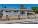Beautiful home with decorative white fencing and a freshly landscaped front yard at 2105 Berkley Ave, Las Vegas, NV 89101