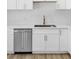 Modern kitchen featuring stainless steel appliances, white cabinetry, and marble countertops at 2105 Berkley Ave, Las Vegas, NV 89101