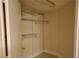 Walk in closet with adjustable wire shelving and neutral walls is ready to be organized at 2153 Jade Creek St # 106, Las Vegas, NV 89117