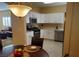 Modern kitchen with white cabinets, stainless steel appliances, and open layout, perfect for entertaining at 2153 Jade Creek St # 106, Las Vegas, NV 89117