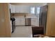 Efficient kitchen layout with white cabinets, stainless steel appliances, and ample counter space at 2153 Jade Creek St # 106, Las Vegas, NV 89117