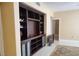Living room featuring a large built-in entertainment center, providing ample storage and display space at 2153 Jade Creek St # 106, Las Vegas, NV 89117