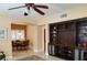 Spacious living room with built-in shelves and cabinets, adjacent to a dining area with plantation shutters at 2153 Jade Creek St # 106, Las Vegas, NV 89117