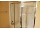 Bathroom shower features a glass door, bright tile, and a built in shower bench at 2153 Jade Creek St # 106, Las Vegas, NV 89117