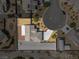 Aerial view of a home showcasing the roof, driveway, and desert landscaping at 230 S Weeping Willow Ct, Pahrump, NV 89048