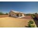 Backyard showcasing desert landscaping and a covered patio area at 230 S Weeping Willow Ct, Pahrump, NV 89048