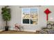 A home interior featuring a view of the neighborhood through a bright, sunny window at 230 S Weeping Willow Ct, Pahrump, NV 89048