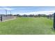 A fenced community dog park has an expansive green space for pets to enjoy at 2383 Elmont Ave, North Las Vegas, NV 89086