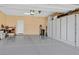 Spacious garage with epoxy flooring, built in storage cabinets, and ample room for vehicles at 2383 Elmont Ave, North Las Vegas, NV 89086
