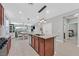 Open kitchen design with a granite island and views to the connected dining and living areas at 2383 Elmont Ave, North Las Vegas, NV 89086