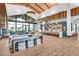 Spacious resident lounge features a kitchen area, television, floor to ceiling windows, and modern decor at 2383 Elmont Ave, North Las Vegas, NV 89086
