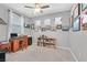 Functional home office with a wooden desk, ample natural light, and neutral wall color at 2383 Elmont Ave, North Las Vegas, NV 89086