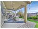 Inviting covered patio with ceiling fan, dining area, and outdoor kitchen perfect for entertaining at 2383 Elmont Ave, North Las Vegas, NV 89086