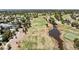 An aerial shot shows a golf course and neighboring homes at 2425 Greens Ave, Henderson, NV 89014