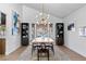 Dining room featuring a modern light fixture, neutral decor, and views of the pool at 2425 Greens Ave, Henderson, NV 89014