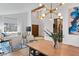 Open-concept dining area with a modern light fixture and comfortable seating at 2425 Greens Ave, Henderson, NV 89014