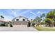 Two-story home with a three-car garage, solar panels, and desert landscaping at 2425 Greens Ave, Henderson, NV 89014