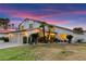 Lovely two-story house featuring a well-manicured lawn, two car garage and desert landscaping at 2425 Greens Ave, Henderson, NV 89014